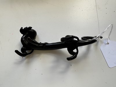 Lot 54 - A CHINESE BRONZE 'CHILONG' BRUSHREST, 17TH CENTURY