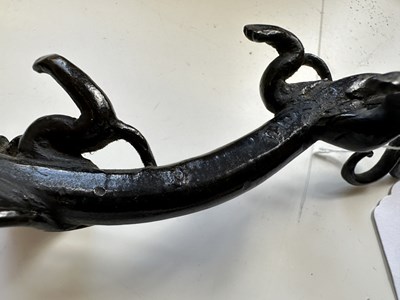 Lot 54 - A CHINESE BRONZE 'CHILONG' BRUSHREST, 17TH CENTURY