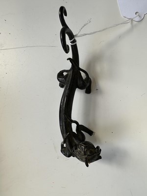Lot 54 - A CHINESE BRONZE 'CHILONG' BRUSHREST, 17TH CENTURY