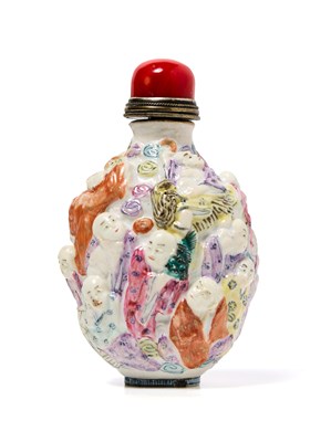 Lot 134 - A FAMILLE-ROSE ENAMELLED MOULDED PORCELAIN 'EIGHTEEN LUOHAN' SNUFF BOTTLE, REPUBLIC PERIOD