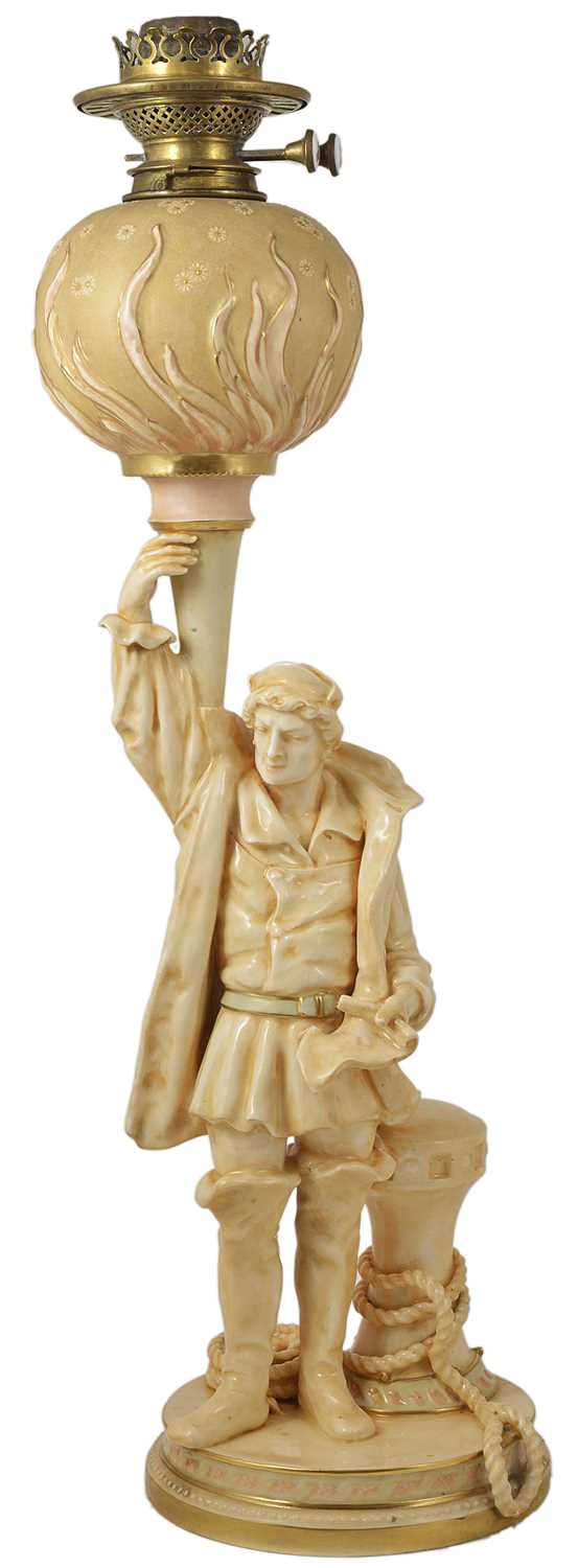 Lot 38 - A 'VELLUM' WARE CHRISTOPHER COLUMBUS FIGURE OIL LAMP