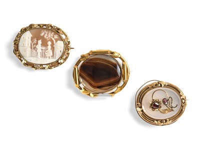 Lot 370 - THREE VICTORIAN GILT-METAL BROOCHES, 1860s