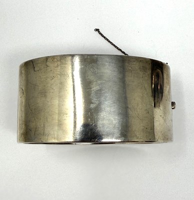 Lot 372 - TWO HINGED SILVER BANGLES, 1883 & 1909