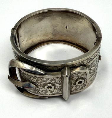 Lot 372 - TWO HINGED SILVER BANGLES, 1883 & 1909