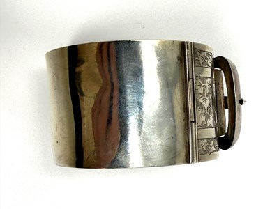 Lot 372 - TWO HINGED SILVER BANGLES, 1883 & 1909