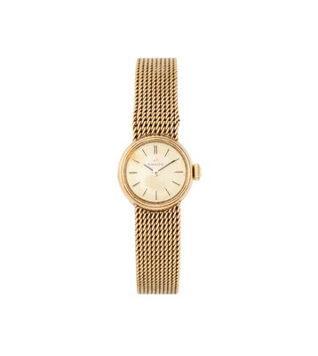 Lot 330 - OMEGA: LADY'S GILT-METAL WATCH ON GOLD BRACELET, CIRCA 1960