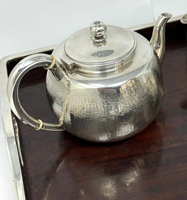 Lot 68 - A JAPANESE SILVER THREE-PIECE TEA SET ON SILVER-MOUNTED WOOD TRAY, MIYAMOTO SHOKO, TOKYO, CIRCA 1925