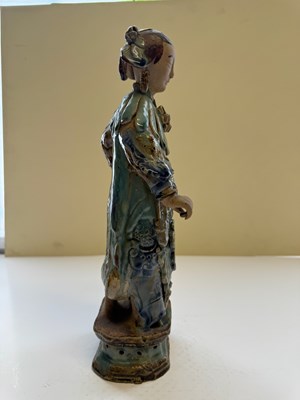 Lot 83 - A PAIR OF CHINESE SHIWAN GLAZED STONEWARE FIGURES OF COURT LADIES, QING DYNASTY, CIRCA 1900