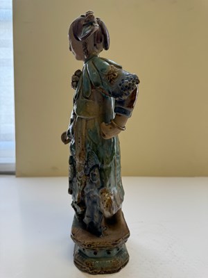 Lot 83 - A PAIR OF CHINESE SHIWAN GLAZED STONEWARE FIGURES OF COURT LADIES, QING DYNASTY, CIRCA 1900