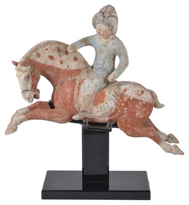 Lot 69 - A CHINESE PAINTED POTTERY EQUESTRIAN FIGURE OF A FEMALE POLO PLAYER
