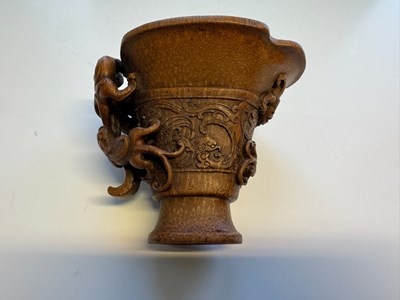 Lot 31 - A CHINESE CARVED BAMBOO 'CHILONG' LIBATION CUP, QING DYNASTY, EARLY 19TH CENTURY