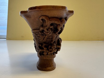 Lot 31 - A CHINESE CARVED BAMBOO 'CHILONG' LIBATION CUP, QING DYNASTY, EARLY 19TH CENTURY