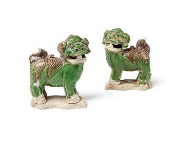 Lot 2 - A PAIR OF CHINESE MINIATURE BISCUIT SANCAI-GLAZED BUDDHIST LIONS, CIRCA 1725