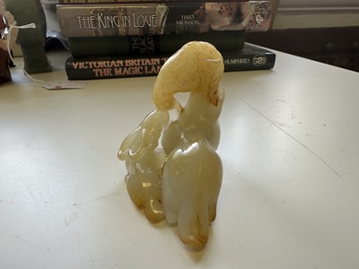 Lot 23 - A CHINESE PALE CELADON JADE RAM GROUP, QING DYNASTY, 18TH CENTURY