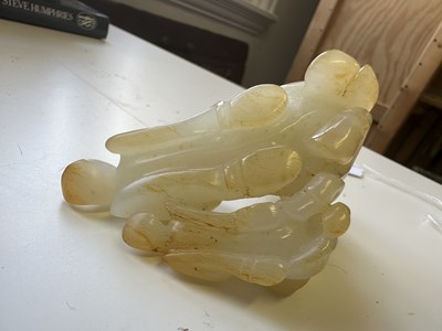 Lot 23 - A CHINESE PALE CELADON JADE RAM GROUP, QING DYNASTY, 18TH CENTURY