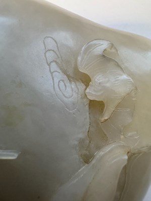 Lot 22 - A CHINESE PALE CELADON JADE 'PEACH AND BAT' GROUP, QING DYNASTY, 18TH CENTURY
