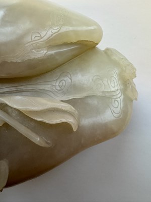 Lot 22 - A CHINESE PALE CELADON JADE 'PEACH AND BAT' GROUP, QING DYNASTY, 18TH CENTURY