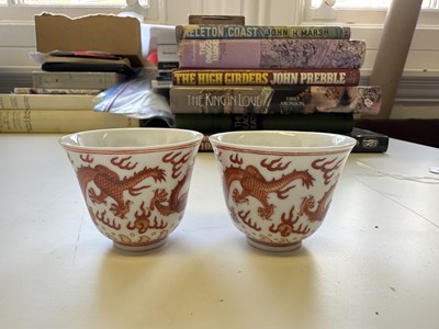 Lot 78 - A PAIR OF IRON-RED 'DRAGON' CUPS, TONGZHI MARKS AND OF THE PERIOD (1862-74)