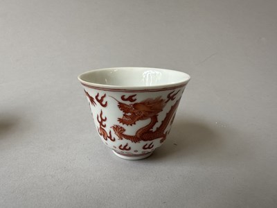Lot 78 - A PAIR OF IRON-RED 'DRAGON' CUPS, TONGZHI MARKS AND OF THE PERIOD (1862-74)