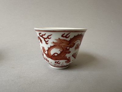 Lot 78 - A PAIR OF IRON-RED 'DRAGON' CUPS, TONGZHI MARKS AND OF THE PERIOD (1862-74)