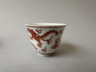 Lot 78 - A PAIR OF IRON-RED 'DRAGON' CUPS, TONGZHI MARKS AND OF THE PERIOD (1862-74)