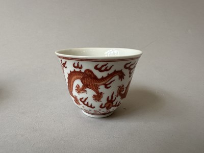 Lot 78 - A PAIR OF IRON-RED 'DRAGON' CUPS, TONGZHI MARKS AND OF THE PERIOD (1862-74)