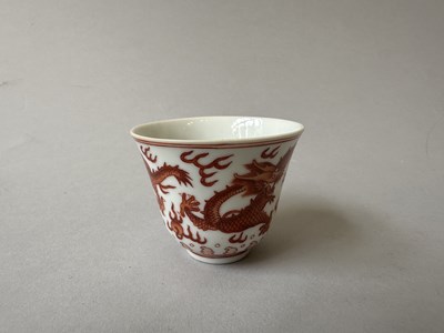 Lot 78 - A PAIR OF IRON-RED 'DRAGON' CUPS, TONGZHI MARKS AND OF THE PERIOD (1862-74)