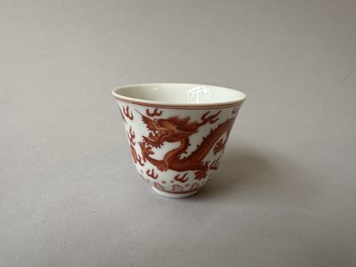 Lot 78 - A PAIR OF IRON-RED 'DRAGON' CUPS, TONGZHI MARKS AND OF THE PERIOD (1862-74)