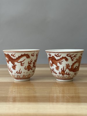 Lot 78 - A PAIR OF IRON-RED 'DRAGON' CUPS, TONGZHI MARKS AND OF THE PERIOD (1862-74)