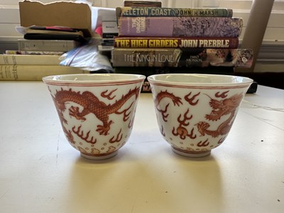 Lot 78 - A PAIR OF IRON-RED 'DRAGON' CUPS, TONGZHI MARKS AND OF THE PERIOD (1862-74)