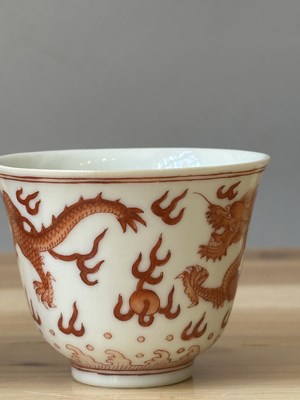 Lot 78 - A PAIR OF IRON-RED 'DRAGON' CUPS, TONGZHI MARKS AND OF THE PERIOD (1862-74)