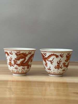 Lot 78 - A PAIR OF IRON-RED 'DRAGON' CUPS, TONGZHI MARKS AND OF THE PERIOD (1862-74)