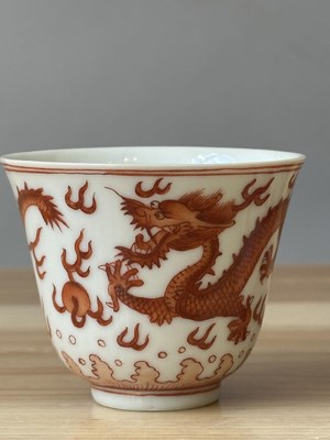 Lot 78 - A PAIR OF IRON-RED 'DRAGON' CUPS, TONGZHI MARKS AND OF THE PERIOD (1862-74)