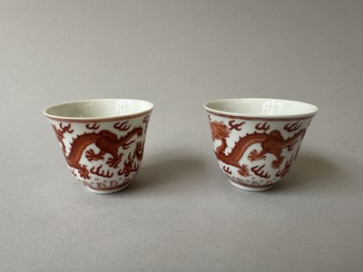 Lot 78 - A PAIR OF IRON-RED 'DRAGON' CUPS, TONGZHI MARKS AND OF THE PERIOD (1862-74)