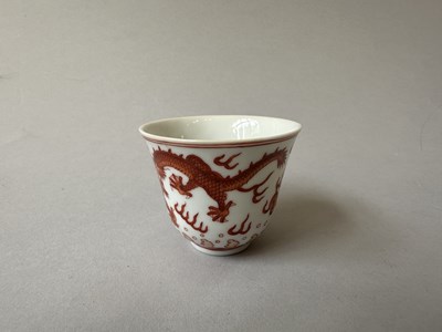Lot 78 - A PAIR OF IRON-RED 'DRAGON' CUPS, TONGZHI MARKS AND OF THE PERIOD (1862-74)