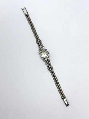 Lot 331 - OMEGA: LADY'S WHITE GOLD AND DIAMOND COCKTAIL WATCH, 1950s