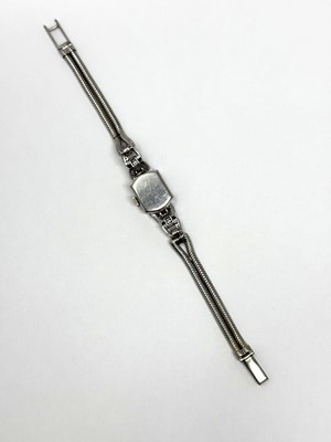 Lot 331 - OMEGA: LADY'S WHITE GOLD AND DIAMOND COCKTAIL WATCH, 1950s