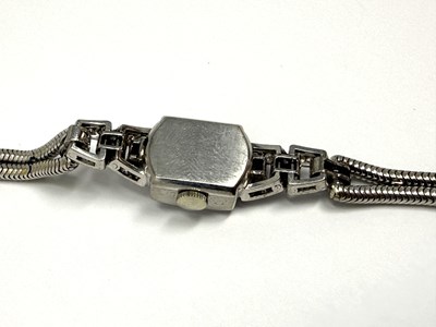 Lot 331 - OMEGA: LADY'S WHITE GOLD AND DIAMOND COCKTAIL WATCH, 1950s