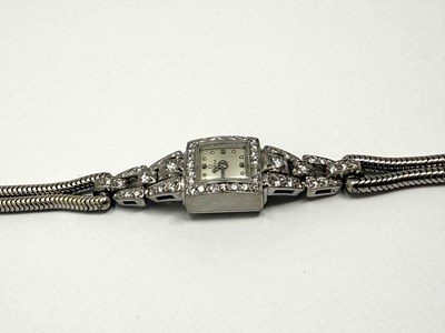 Lot 331 - OMEGA: LADY'S WHITE GOLD AND DIAMOND COCKTAIL WATCH, 1950s