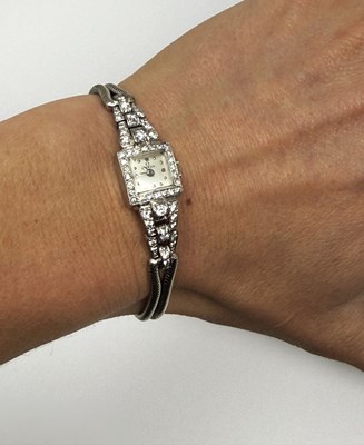 Lot 331 - OMEGA: LADY'S WHITE GOLD AND DIAMOND COCKTAIL WATCH, 1950s