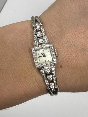Lot 331 - OMEGA: LADY'S WHITE GOLD AND DIAMOND COCKTAIL WATCH, 1950s