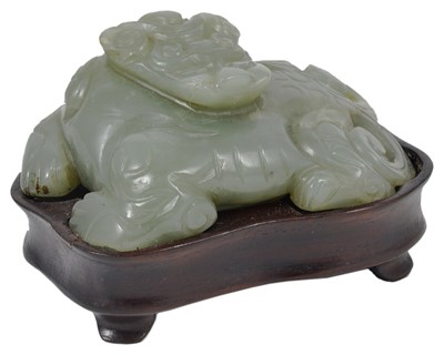 Lot 73 - A CHINESE CELADON JADE CARVING OF A BIXIE