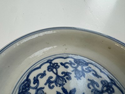 Lot 6 - A CHINESE BLUE AND WHITE PEACH AND POMEGRANATE SAUCER DISH, CHENGHUA MARK, KANGXI PERIOD (1662-1722)