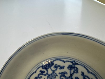 Lot 6 - A CHINESE BLUE AND WHITE PEACH AND POMEGRANATE SAUCER DISH, CHENGHUA MARK, KANGXI PERIOD (1662-1722)
