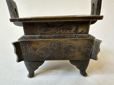 Lot 58 - A CHINESE ARCHAISTIC BRONZE CENSER, FANG DING