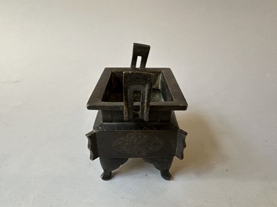 Lot 58 - A CHINESE ARCHAISTIC BRONZE CENSER, FANG DING