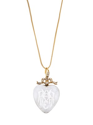 Lot 411 - VICTORIAN ROCK CRYSTAL INTAGLIO, HALF-PEARL AND GOLD PENDANT, 1879