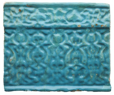 Lot 91 - A KASHAN MOULDED TURQUOISE TILE, PERSIA, CIRCA 13TH CENTURY