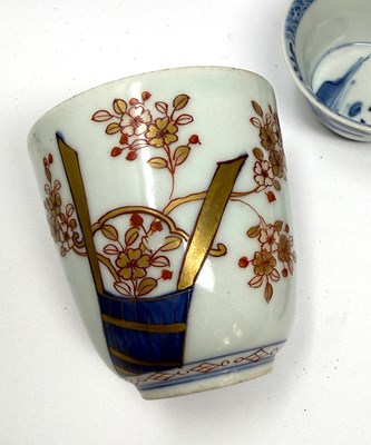 Lot 3 - A CHINESE BLUE AND WHITE TEA BOWL, KANGXI PERIOD (1662-1722) AND AN ARITA BEAKER, CIRCA 1700, BOTH WITH 'JOHANNEUM' INVENTORY NUMBERS