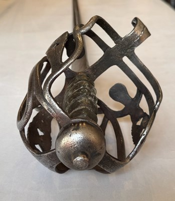 Lot 4 - AN ENGLISH BASKET-HILTED CAVALRY BACKSWORD, MID-18TH CENTURY
